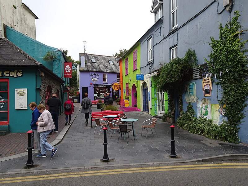 An image looking up market street in Kinsale. It has colourful buildings on both the left and right